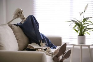 depositphotos_341749520-stock-photo-human-skeleton-with-book-on.jpg