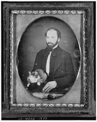 hombre-sentado-gato-1840-1860-dominio-publico.jpeg.webp